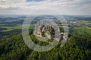 Hohenzollern Castle on forested mountain top in the Swabian Alps in summer