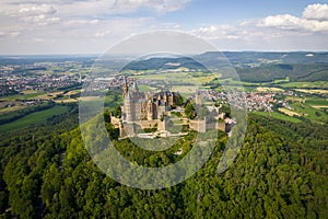 Hohenzollern Castle on forested mountain top in the Swabian Alps in summer