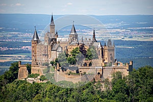 Hohenzollern Castle on mountain top. Germany. Famous landmark in vicinity of Stuttgart. Scenic view of Burg Hohenzollern