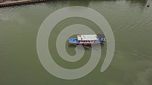 Hoi An channel landscape motorboat sails along channel