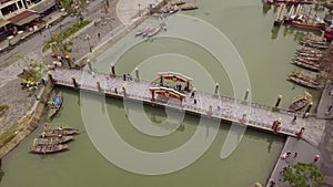 Hoi An channel urban landscape old footbridge over canal