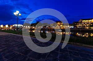 Hoi An city lights across the Thu Bon river in Vietnam