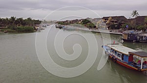 Hoi An river landscape motorboat sails along channel