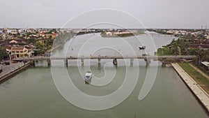 Hoi An river landscape transport bridge between city banks