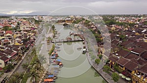 Hoi An river urban landscape channel with bridge and boats