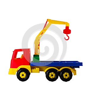 Hoisting crane toy on a white isolated