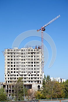 Hoisting tower crane and top of construction building