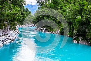 Hokitika Gorge, West Coast, New Zealand. Beautiful nature with blueturquoise color water and wooden swing bridge