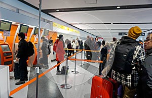 Crowd of tourists waiting for check in front of Jetstar airline counter