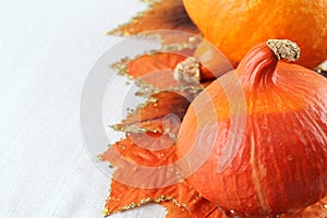 Hokkaido pumpkins with autumn leaves