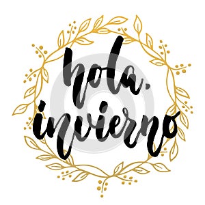 Hola, invierno - hello, winter in spanish, hand drawn lettering latin quote with golden wreath isolated on the white background. F photo