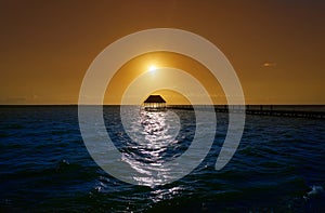 Holbox island sunset beach pier hut Mexico