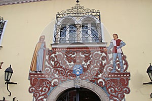 HOld painting above the entrance door of on a medieval building. Windischgarsten, Austria.