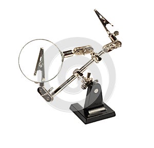 holder with clamps and magnifying glass for soldering, isolated on white background