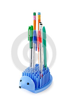 Holder full of pen and pencil isolated on white background