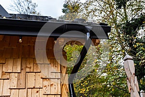 Holder gutter drainage system on the roof. Drain on the roof of the house. Roof drainage. Water drainage from the roof