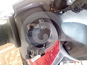 Holder with multiple buttons on motorcycle