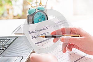 Holding blank employment application form
