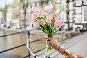 Holding tulips in Amsterdam