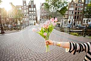 Holding tulips in Amsterdam