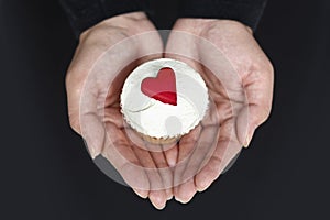 Holding a Cupcake with Love Hearts