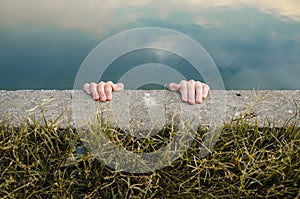 Holding on the edge of a cliff photo