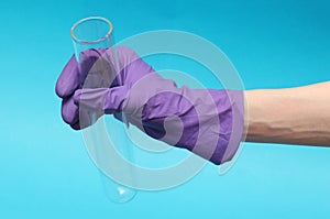 Holding empty test tube with glove