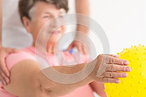 Holding exercise ball in physiotherapy