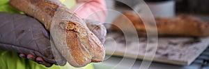 Holding freshly baked home made bread