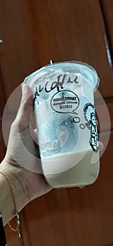 holding a glass of milk