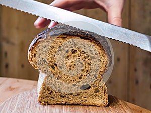 Holding Granary Bread while Slicing