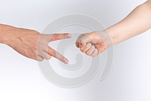 Holding guessing fist gesture in front of the white background