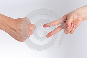 Holding guessing fist gesture in front of the white background