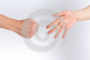 Holding guessing fist gesture in front of the white background