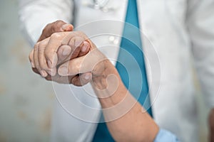 Holding hands Asian senior or elderly old lady woman patient with love, care, encourage and empathy at nursing hospital ward,