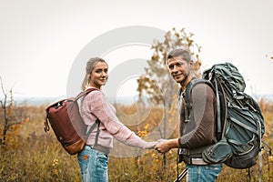 Holding Hands Couple Of Travelers Stands Outdoors