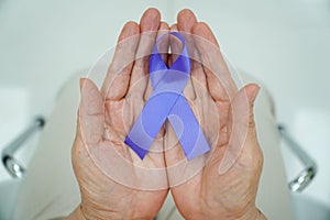 Holding Hands Purple Ribbon on White Background World Epilepsy Alzheimer's Pancreatic Cancer Epilepsy Awareness Fibromyalgia