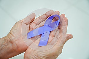 Holding Hands Purple Ribbon on White Background World Epilepsy Alzheimer's Pancreatic Cancer Epilepsy Awareness Fibromyalgia