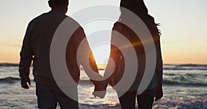 Holding hands, sunset and silhouette of couple at beach for relax, summer vacation and travel. Happy, adventure and