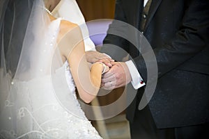 Holding the hands together in wedding ceremony
