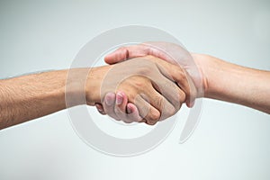 Holding hands of two men on a white background,Friends,Dear friend,Relationship