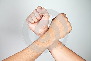 Holding hands of two men on a white background,Friends,Dear friend,Relationship