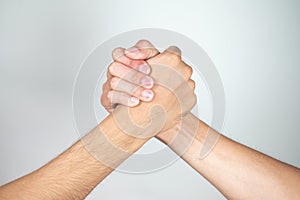 Holding hands of two men on a white background,Friends,Dear friend,Relationship