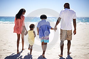 Holding hands, walking and black family at the beach together on tropical vacation, adventure or holiday. Love, travel