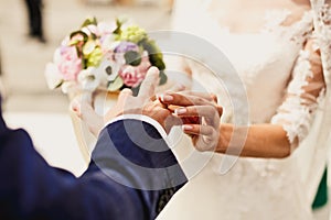 Holding hands with wedding rings