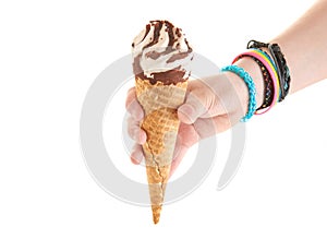 Holding ice cream with chocolate in cone in hand isolated on white background