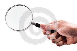 Holding a magnifying glass over white