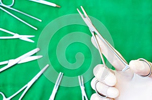 holding a needle holder on sterile drape