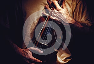 Holding an Old Violin