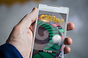 holding online casino smartphone